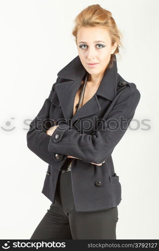 Portrait of a beautiful girl in a black suit