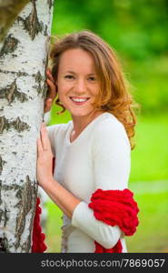 portrait of a beautiful girl in spring park near birch