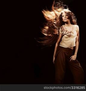 Portrait of a beautiful girl with flying long hair