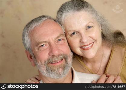 Portrait of a beautiful gray haired middle aged couple in love.
