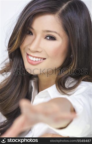 Portrait of a beautiful happy sexy young Chinese Asian woman or girl reaching her hand to the camera