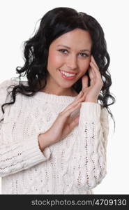 portrait of a beautiful happy woman in a knitted jacket