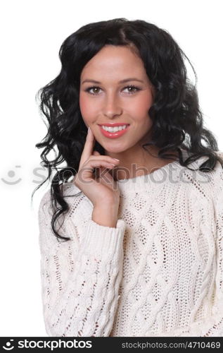 portrait of a beautiful happy woman in a knitted jacket