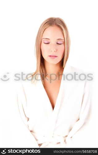 Portrait of a beautiful healthy young blonde woman in a white spa bath robe