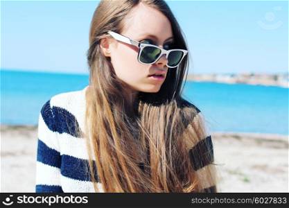 portrait of a beautiful hipster girl in glasses close up. woman on vacation.
