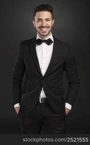 Portrait of a beautiful latin man smiling wearing a tuxedo