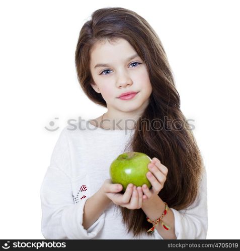 Portrait of a beautiful little girl holding a green apple, isolated on white background