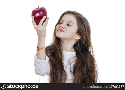 Portrait of a beautiful little girl holding a red apple, isolated on white background