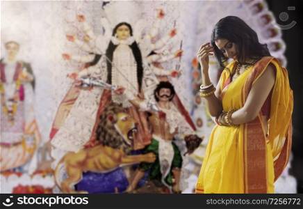 Portrait of a beautiful Married Bengali Married woman at Durga puja , during Durga puja celebrations