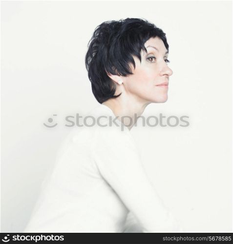 Portrait of a beautiful middle aged woman on white background