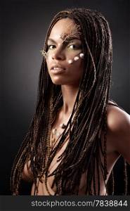 Portrait of a beautiful naked young african american woman with dreadlocks hair &#xA;on a black background