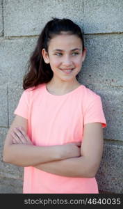 Portrait of a beautiful preteen girl with blue eyes outside