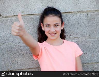 Portrait of a beautiful preteen girl with blue eyes saying Ok