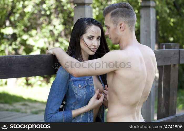 Portrait of a beautiful sexy young couple in blue jeans