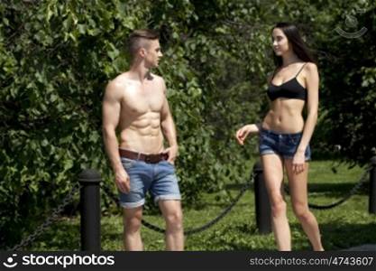 Portrait of a beautiful sexy young couple in blue jeans
