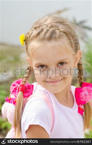 Portrait of a beautiful six year old girl with blond hair