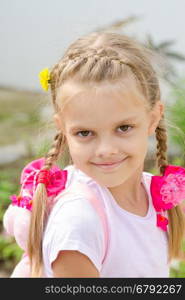 Portrait of a beautiful six year old girl with blond hair