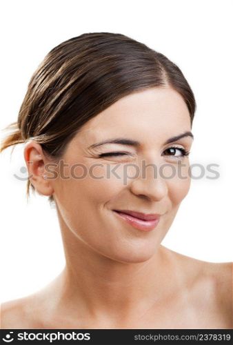 Portrait of a beautiful woman blinking eyes, isolated on white