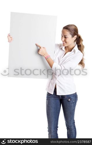 Portrait of a beautiful woman holding a blank billboard and showing something on it