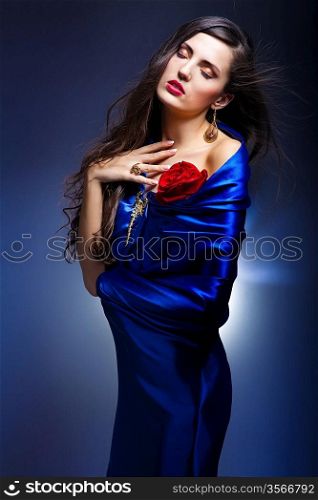 portrait of a beautiful woman in blue dress