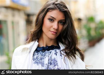 Portrait of a beautiful woman in urban background