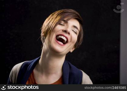 Portrait of a beautiful woman laughing and with a modern hair cut