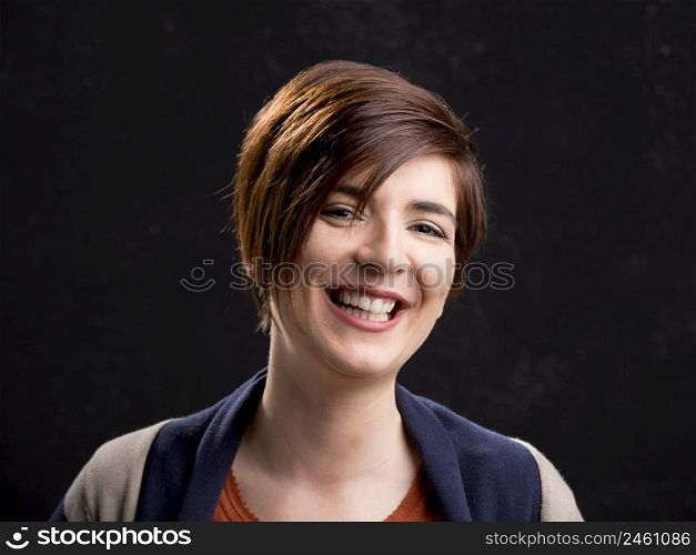 Portrait of a beautiful woman laughing and with a modern hair cut