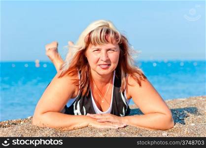 portrait of a beautiful woman on sea background