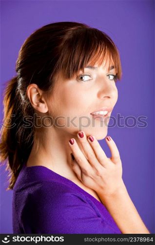 Portrait of a beautiful woman over a violet background