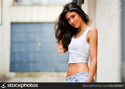 Portrait of a beautiful woman smiling in urban background