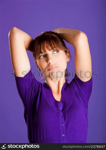 Portrait of a beautiful woman with a bored expression, over a violet background