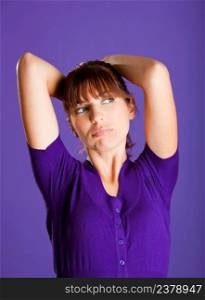 Portrait of a beautiful woman with a bored expression, over a violet background