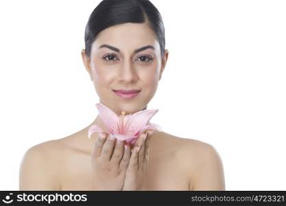 Portrait of a beautiful woman with a flower