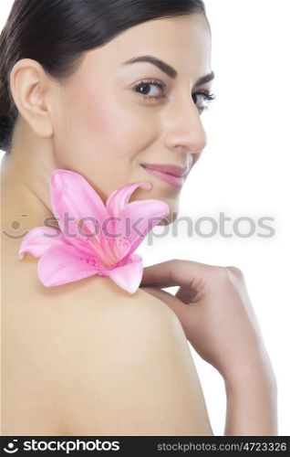 Portrait of a beautiful woman with a flower