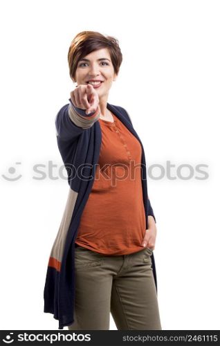 Portrait of a beautiful woman with a happy face and pointing to the camera, isolated over a white background