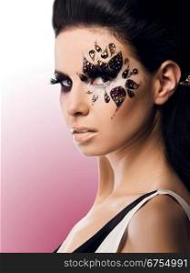 portrait of a beautiful woman with Creative Fashion Makeup.Holiday Make-up