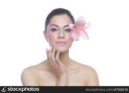 Portrait of a beautiful woman with flower