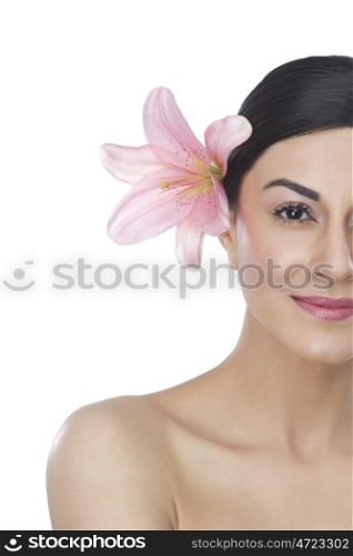 Portrait of a beautiful woman with flower in hair