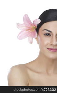 Portrait of a beautiful woman with flower in hair