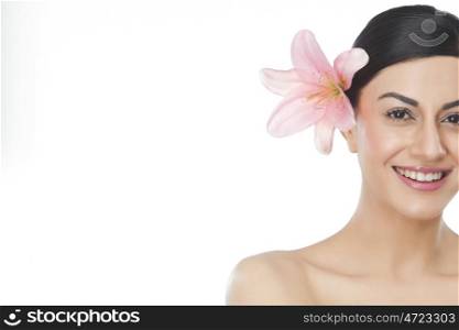 Portrait of a beautiful woman with flower in hair