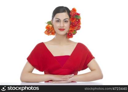 Portrait of a beautiful woman with flowers in hair