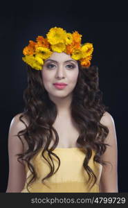 Portrait of a beautiful woman with flowers in her hair