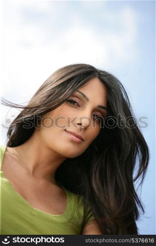 Portrait of a beautiful woman with long brown hair
