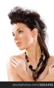 Portrait of a beautiful woman with long dark hair and a creative style with a necklace