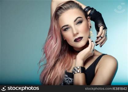 Portrait of a beautiful woman with stylish pink hair over blue background, attractive young girl with dark lips, special style makeup for Gothic party