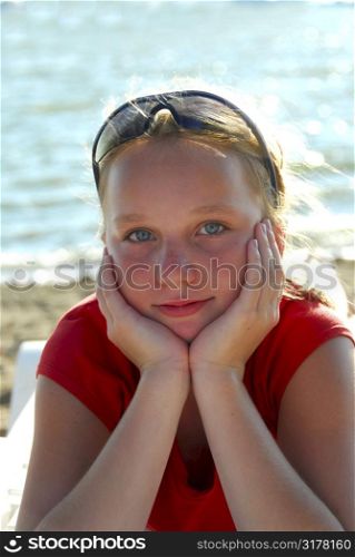 Portrait of a beautiful young girl on a beach