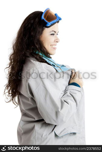 Portrait of a beautiful young girl wearing a winter coat and snow glasses