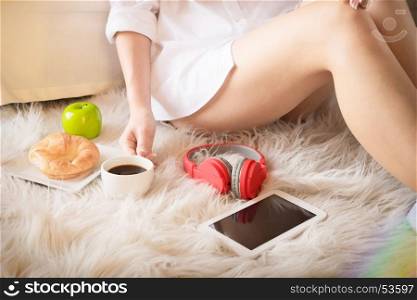 Portrait of a beautiful young lady drinking her morning coffee in her bedroom, Soft light and comfort natural lifestyle