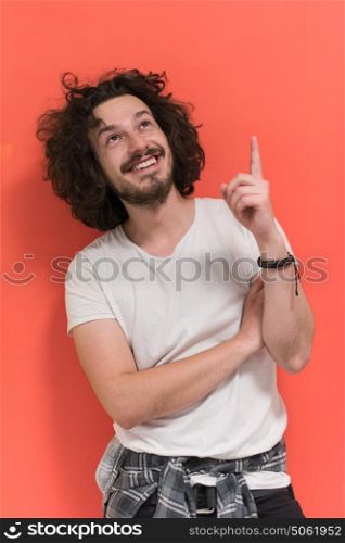 Portrait of a beautiful young man with funny hair over color background with copyspace expressing different emotions