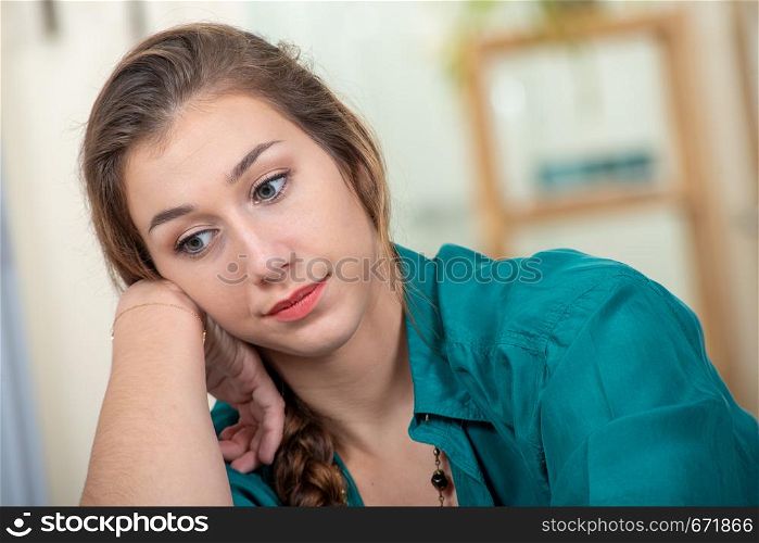 portrait of a beautiful young pensive woman